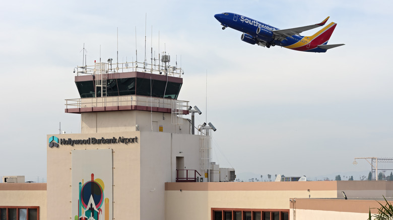 plane takes off above Burbank Airport