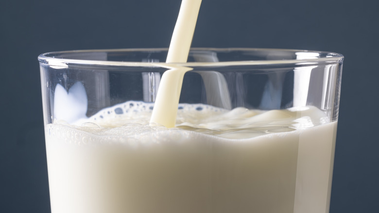 milk being poured into a glass
