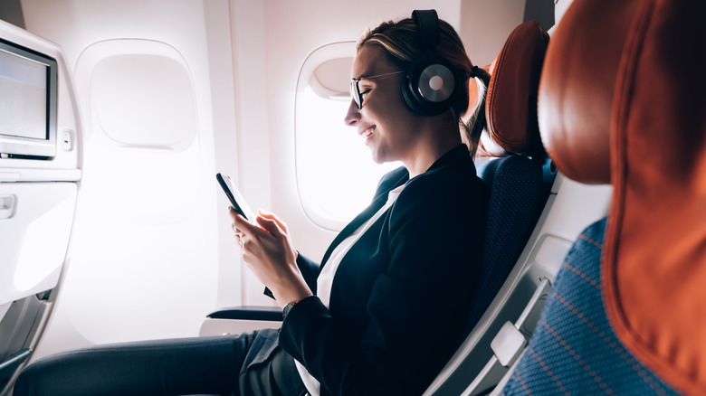 Woman reclining on plane