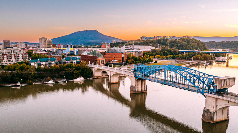 Bridge over the Tennessee River to downtown Chattanooga at dusk with Lookout Mountain in the background