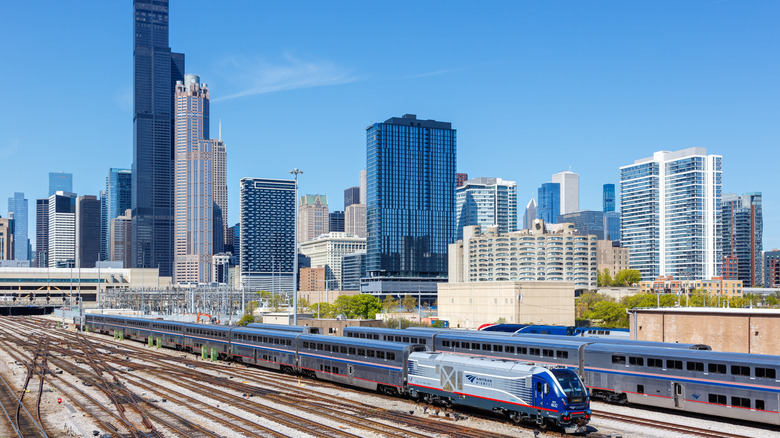Amtrak trains cross each other in front of downtown Chicago, Illinois