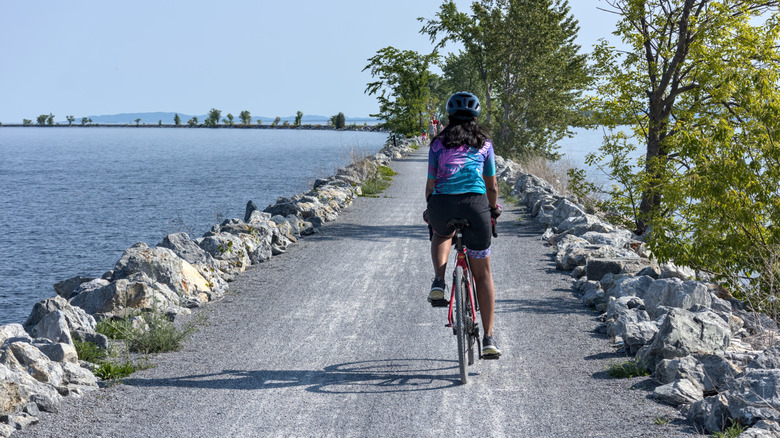A cyclist pedals down the Island Line Trail in Vermont
