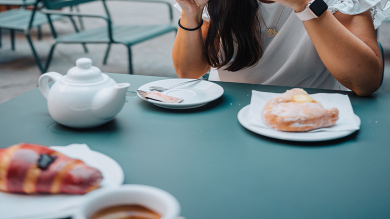 Woman eating breakfast in Italy