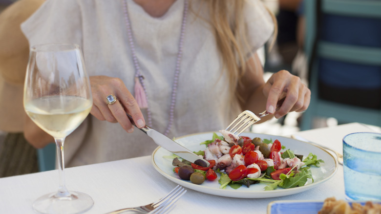 A woman eating in Italy