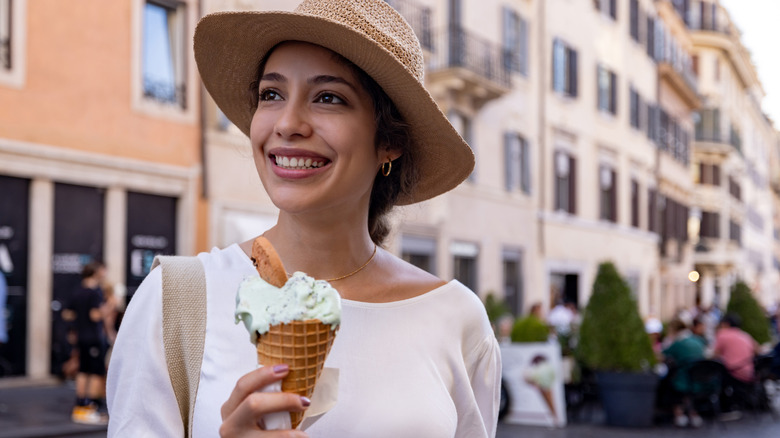 Woman eating gelato in Italy