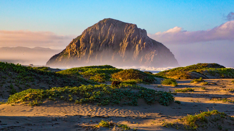 Sand dunes in front of Morro Rock in Morro Bay, California
