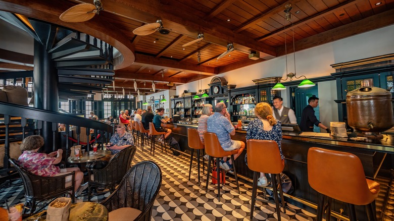 Elegant bar with tiled floors and wooden ceiling