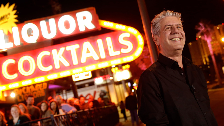 Anthony Bourdain by neon sign