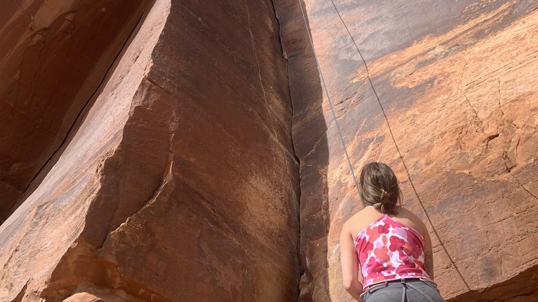 A climber prepares ropes before an ascent