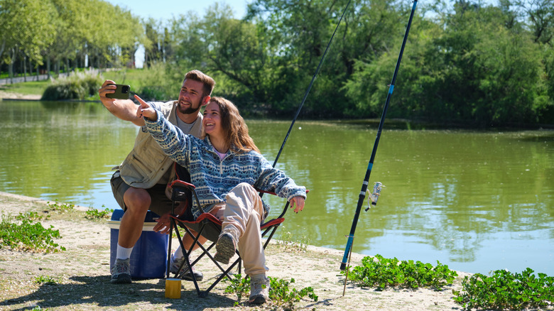 Couple fishing by the river