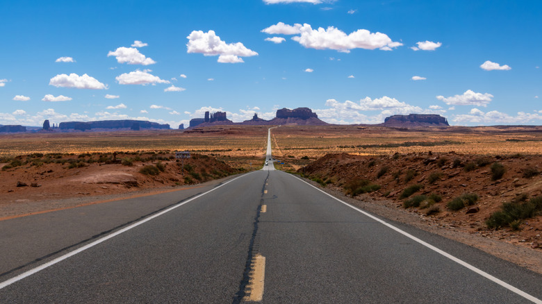A road cutting through the Arizona desert