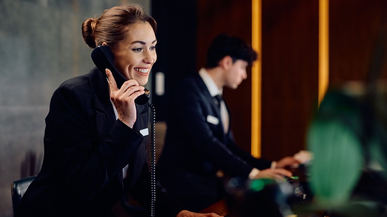 hotel representative speaking on phone