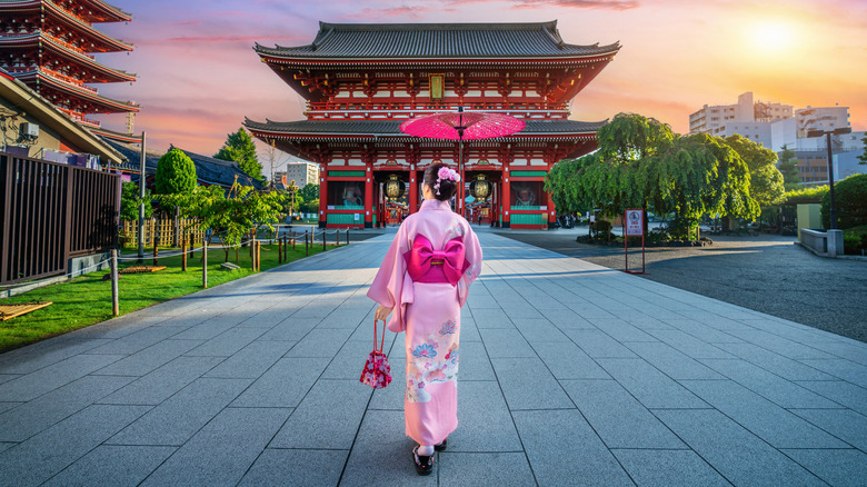 back view of a woman wearing japanese traditional kimono at a temple