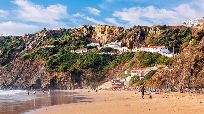 Cliffs above golden sand at Arrifana Beach, Aljezur