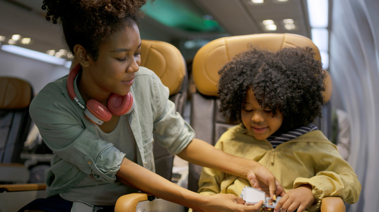 Woman flying with her child