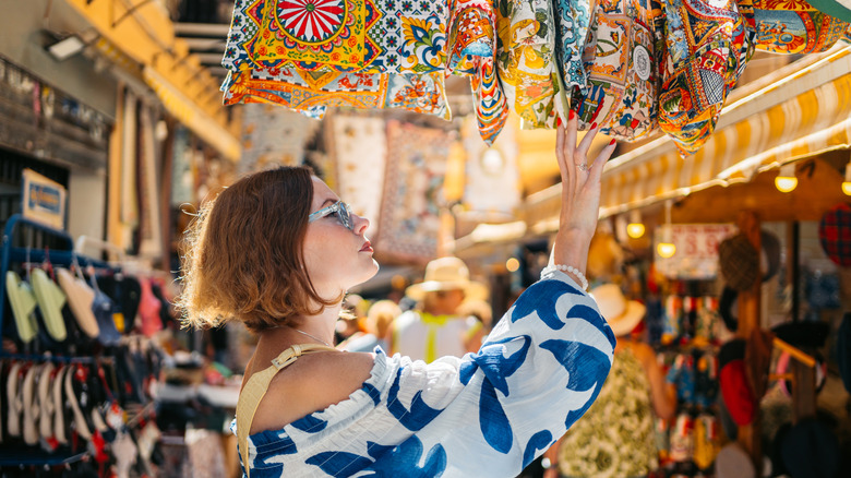 A woman at a market in Italy.