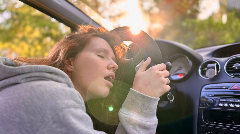 woman sleeping in car