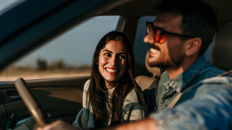 couple smiling in car