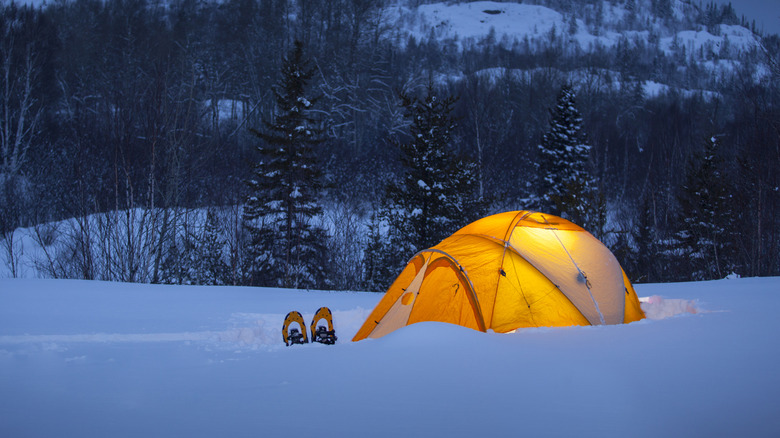 Lit tent in the middle of Canada snow