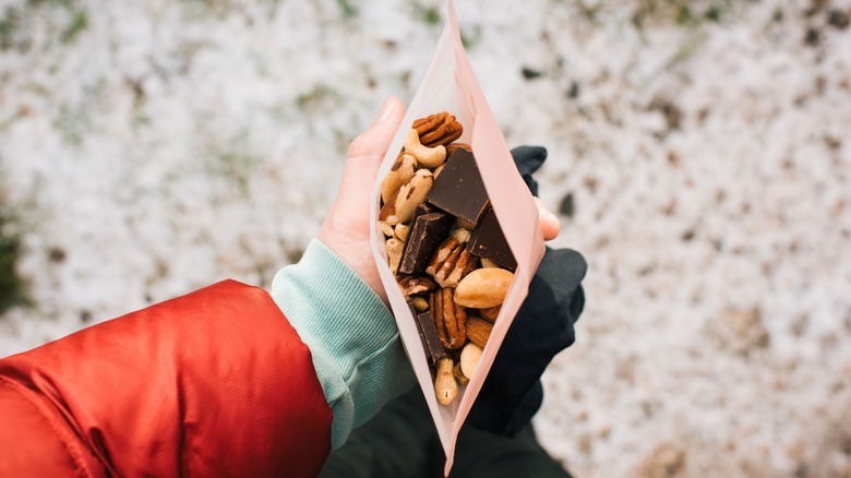 Hiker holding bag of trail mix