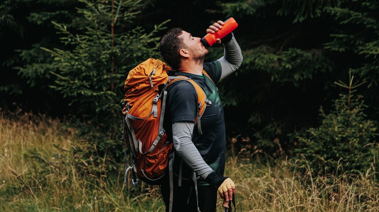 Hiker drinking water