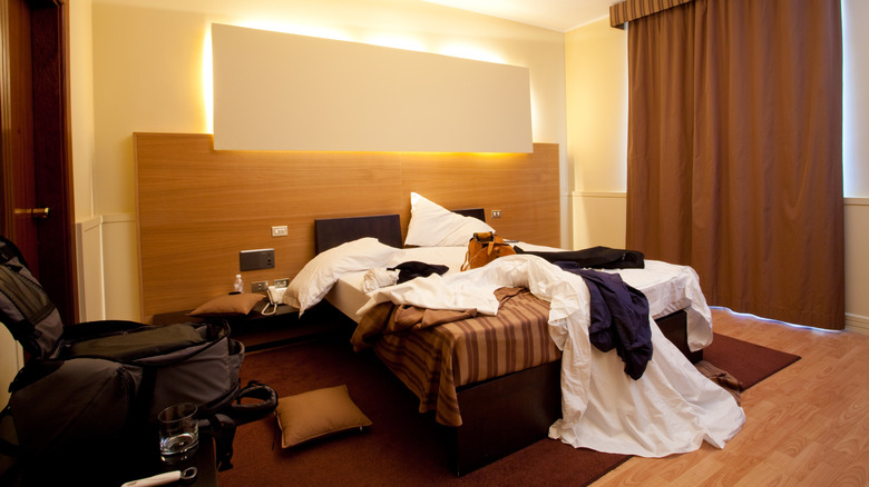 a messy and confused hotel room