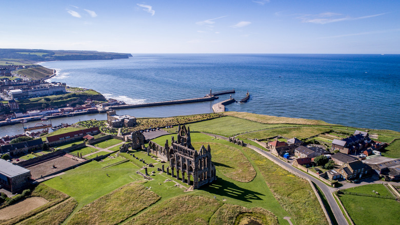 Aerial view of Whitby Abbey on cliffs overlooking the town