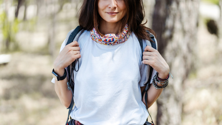 Woman in cotton T-shirt with backpack