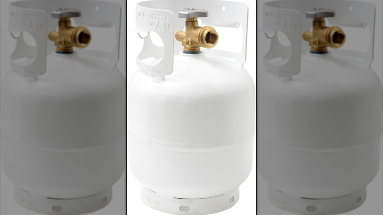 Side view of propane tank on plain background
