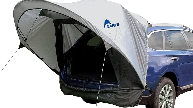Vehicle awning set up behind SUV