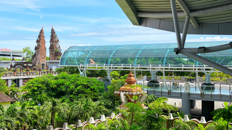 View of gardens and traditional Balinese gate at Bali Airport
