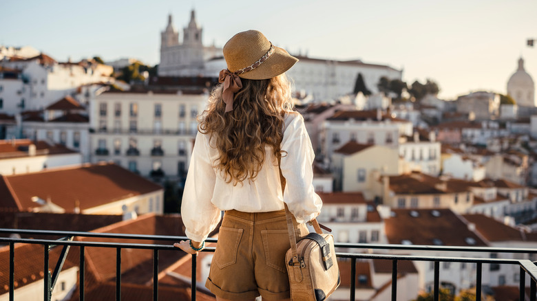 Woman on hotel balcony, Europe