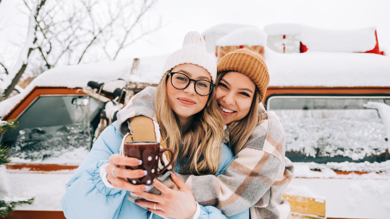 Friends car camping during winter