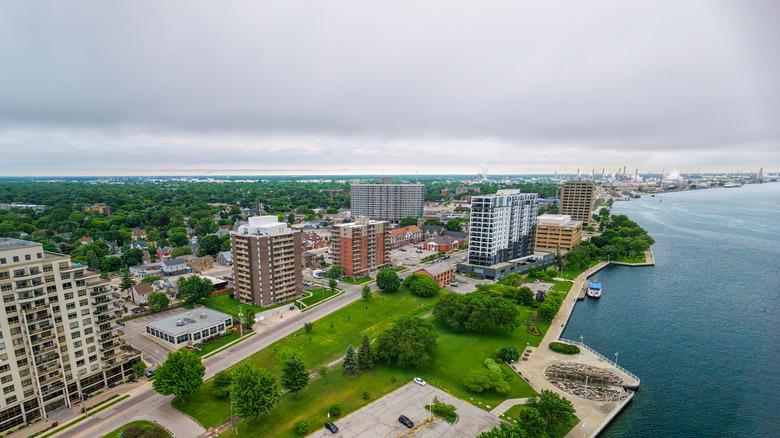 Image of downtown Sarnia, some buildings, grassy areas, and waterfront