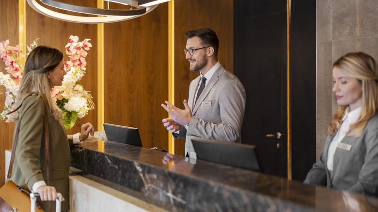 Woman checking in at hotel