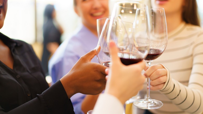 A group of women tasting red wine