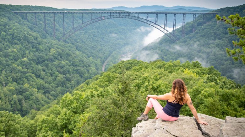 Woman looking out over the New River Gorge Bridge
