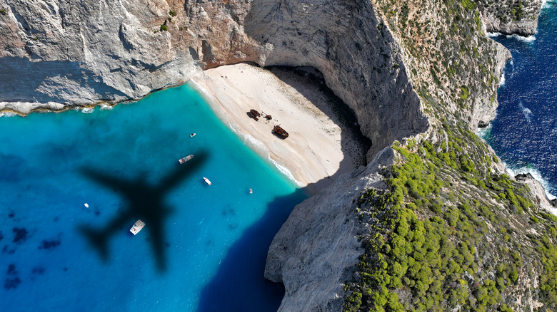airplane shadow over beach