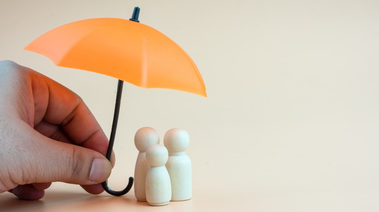 Umbrella over statues