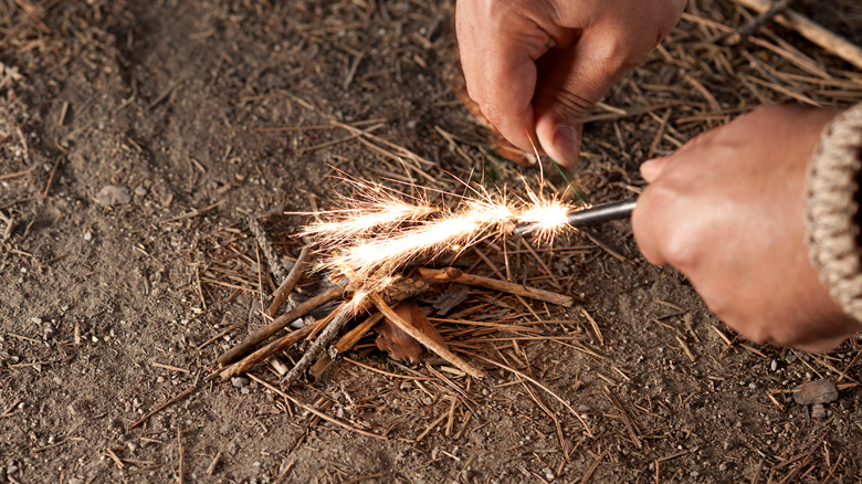 lighting tinder for a new campfire