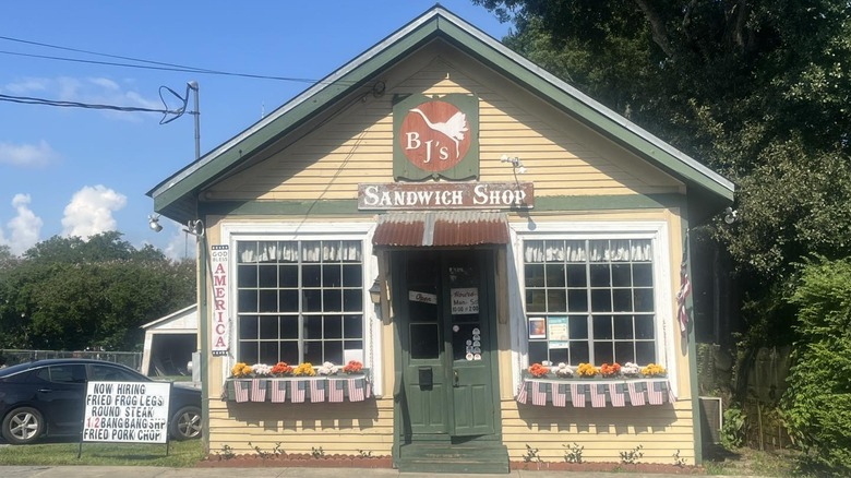 small yellow clapboard restaurant with BJ's sign