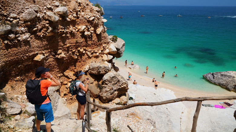 Beachgoers hiking to Cala Goloritze