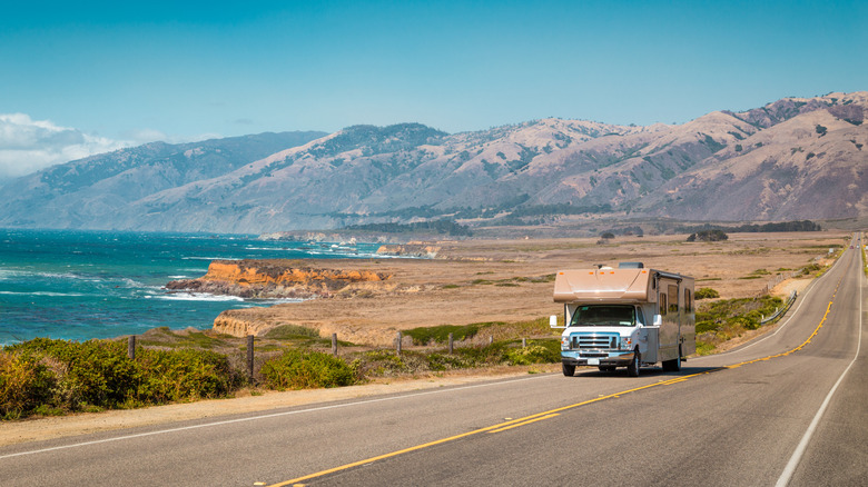 An RV driving along the California coast