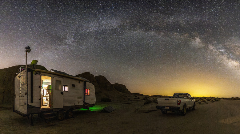 An RV sits under the milky way at Anza-Borrego Desert State Park, California