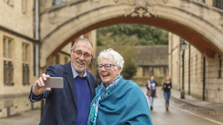 older couple taking selfie at Oxford