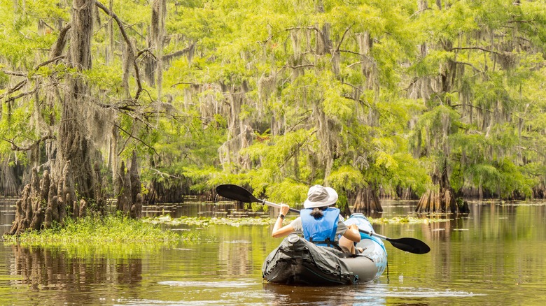 Woman kayaking at Caddo Lake State Park