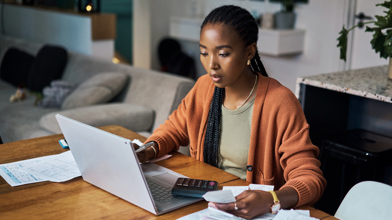 Woman doing taxes at home