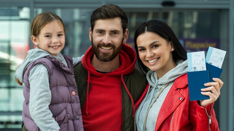 Family with plane tickets