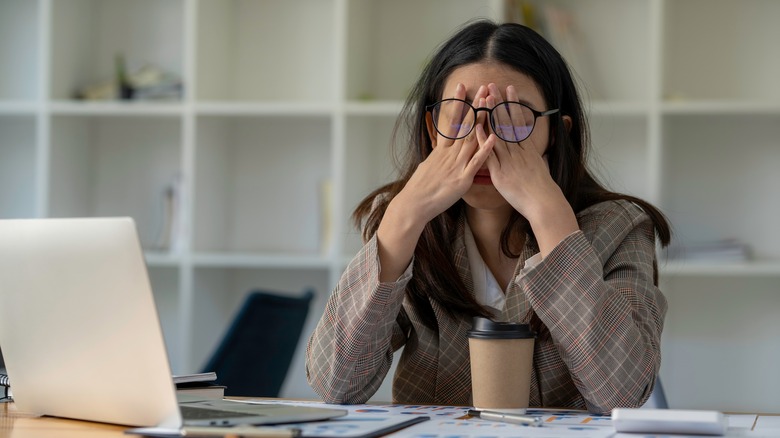 Frustrated woman sitting at a desk