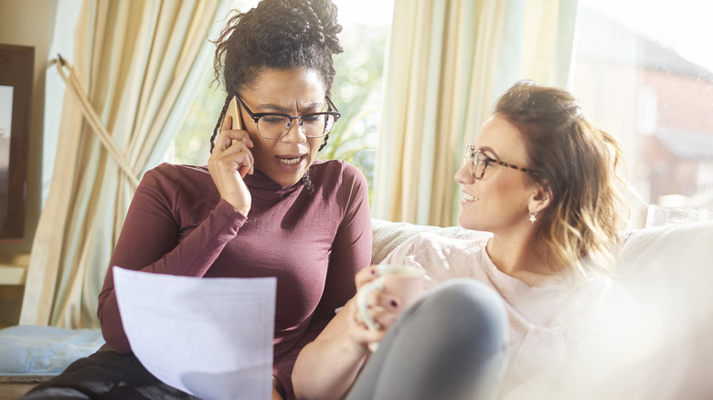 woman couple shopping travel insurance